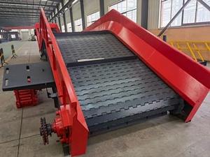 Transportador de placas articuladas